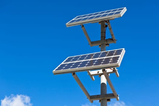 Solar panels on bright blue sky background. Renewable Energy. Horizontal shot