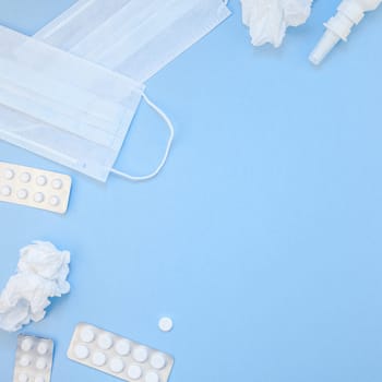 Creative flat lay concept of seasonal spring allergy with napkins, pills, face mask and drops in a bottle with copy space square background minimal style, template for text
