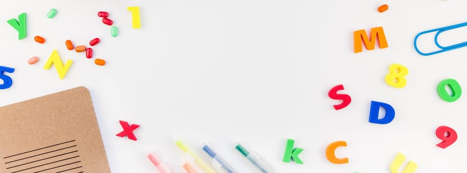 Long wide banner back to school concept with color school and office supplies on white table background with copy space, frame, template for text or design