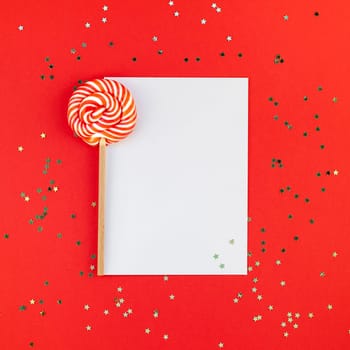 Creative New Year or Christmas greetings letter mockup flat lay top view Xmas holiday celebration envelope on red paper background golden glitter. Square Template mock up greeting card text 2019 2020