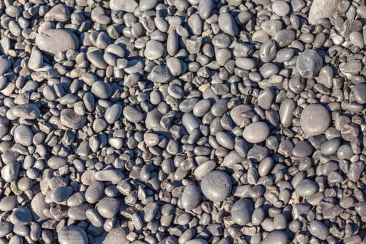 Icelandic Beach Pebbles Background. Horizontal outdoor shot with a selective focus