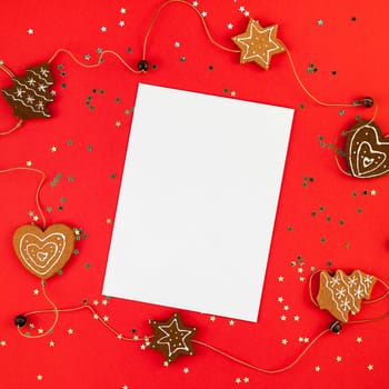 Creative New Year or Christmas greetings letter mockup flat lay top view Xmas holiday celebration envelope on red paper background golden glitter. Square Template mock up greeting card text 2019 2020