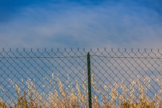 Razor and barbed wire fence. Forbidden place