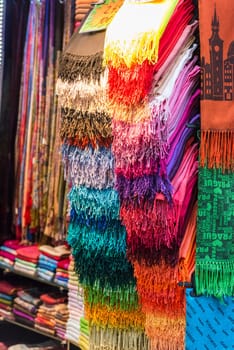 Selection of colorful women scarves at a market