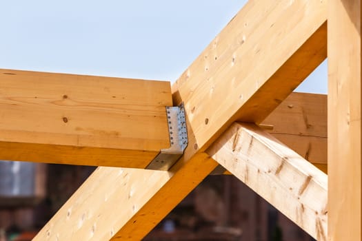 Construction of new wooden house. Beams frame close up