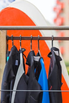 Diving suits and surf boards in a store. France