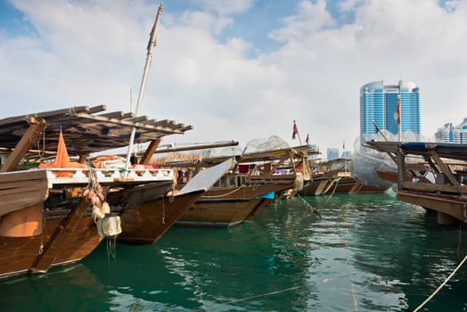 Old fishing boats in Abu Dhabi, UAE. Overcast day