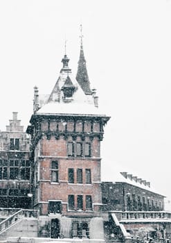 Antwerp Castle "The Steen"" at winter snowstorm. Vertical toned image"