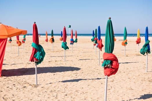 The famous colorful parasols on Deauville beach, Normandy, Northern France