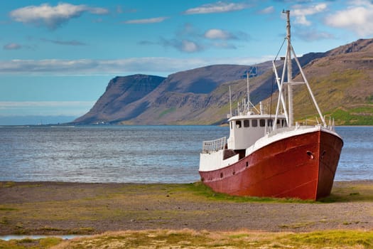An old fishing vessel that shipwrecked on the northern coast of Iceland in the Westfjords region