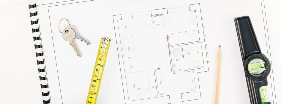 Creative flat lay overhead top view blueprint flat project plan and office supplies on decorator table workspace swatches tools and equipment background copy space concept