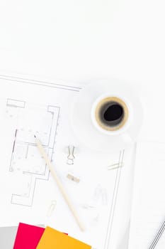 Creative flat lay overhead top view blueprint flat project plan hot coffee cup alarm clock and office supplies on decorator table workspace swatches tools and equipment background copy space concept