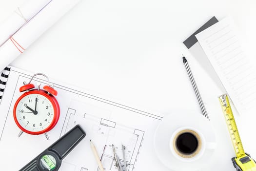 Creative flat lay overhead top view blueprint flat project plan hot coffee cup alarm clock and office supplies on decorator table workspace swatches tools and equipment background copy space concept