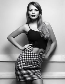 pretty young woman in black and white in miniskirt, AI generated image
