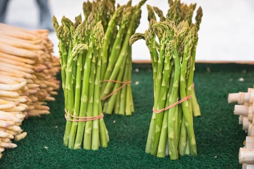 Fresh asparagus selling in a farmers market. Shot with a selective focus