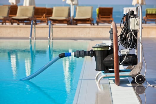 Cleaning pump working with a swimming pool. Horizontal shot