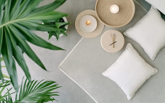 Minimalist home interior featuring potted plants, lit candles, and natural textures, creating a serene and calming atmosphere for relaxation and mindfulness.