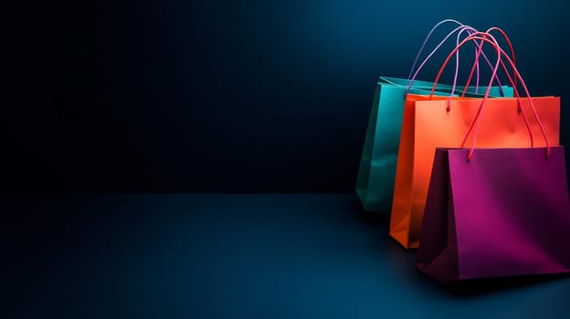 Three colorful shopping bags on a dark background with ample copy space for text.