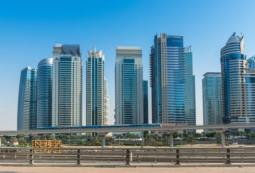 UAE, DUBAI - DECEMBER 31: view of Jumeirah Lakes Towers and metro bridge in Dubai, United Arab Emirates on December 31, 2014