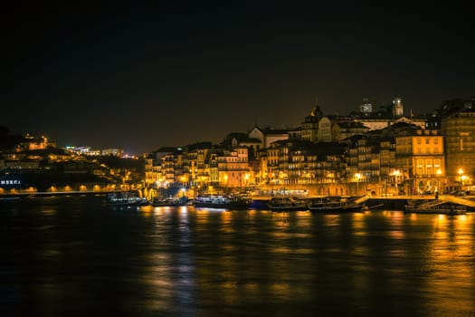 PORTUGAL, PORTO - JANUARY 20: Overview of Old Town of Porto, Portugal at night. Ribeira and Douro river on January 20, 2013