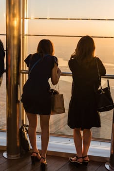 DUBAI, UAE - JANUARY 02: people at the top the observation deck of the highest building in the world Burj al Khalifa on January 02, 2015 in Dubai, United Arab Emirates