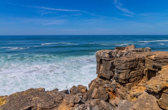 View of ocean waves and fantastic rocky coast in Ericeira, near Lisbon. Portugal