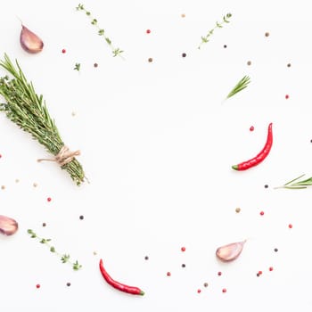 Flat lay overhead top view of greens herbs and spices on white background with copy space. Menu frame design food pattern background with cooking ingredients
