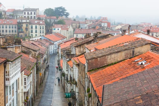 Looking down onto the Rainy Street of Old Town Santiago de Compostela, Spain