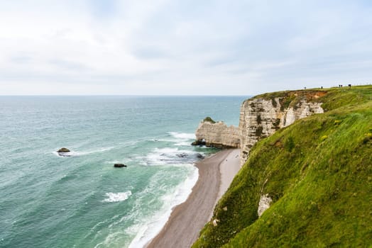 The beach and stone cliffs in Etretat, France, Normandy