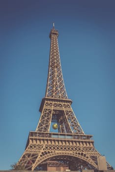 The Eiffel tower with blue clear sky in background Paris France