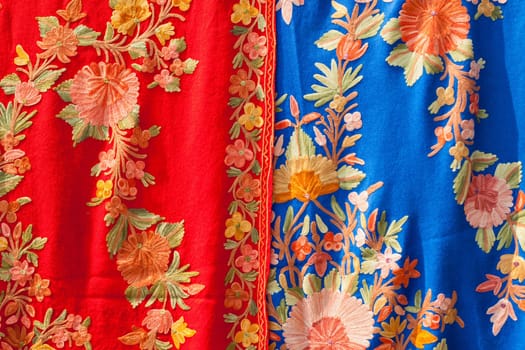 Selection of colorful women scarves at a market