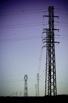Electricity Power Pylons silhouettes. Filtered shot