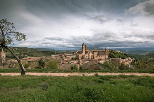 Old Urbino, Italy, cityscape at dull day. Horizontal toned and vignetted image