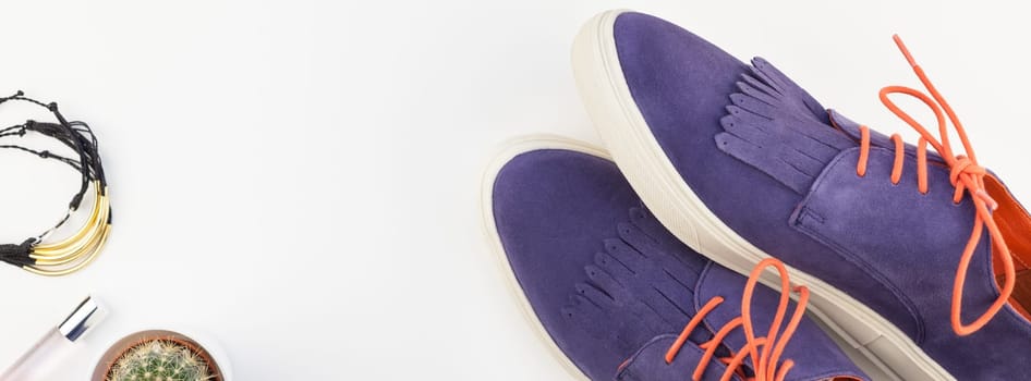 Long wide banner Flat lay of trendy suede shoes, female accessories and cactus on white background with copy space. Overhead view of woman casual outfit. Trendy hipster look top view