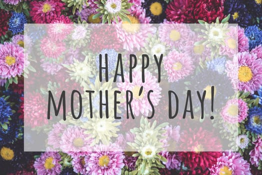 Happy mothers day text on blurred flowers background