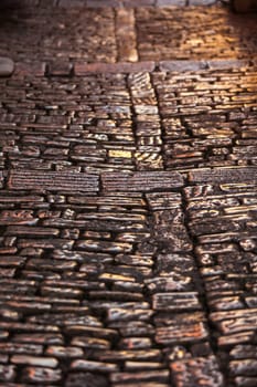 Cobblestone Pavement Close Up Background. Vertical Shot with a selective focus