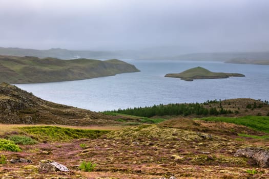 Lake in Pingvellir national park, Iceland. Overcast weather