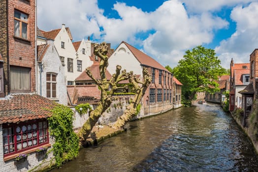 Beautiful canal and old brick buildings of Bruges Belgium