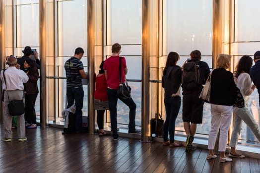 DUBAI, UAE - JANUARY 02: people at the top the observation deck of the highest building in the world Burj al Khalifa on January 02, 2015 in Dubai, United Arab Emirates