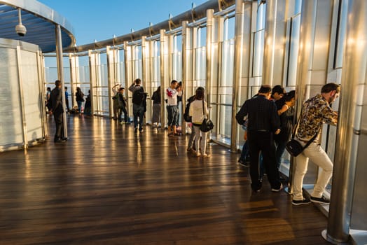 DUBAI, UAE - JANUARY 02: people at the top the observation deck of the highest building in the world Burj al Khalifa on January 02, 2015 in Dubai, United Arab Emirates