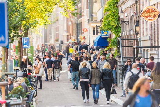 NETHERLANDS, AMSTERDAM - OCTOBER 2: people walking on the street of Amsterdam on October 2, 2015