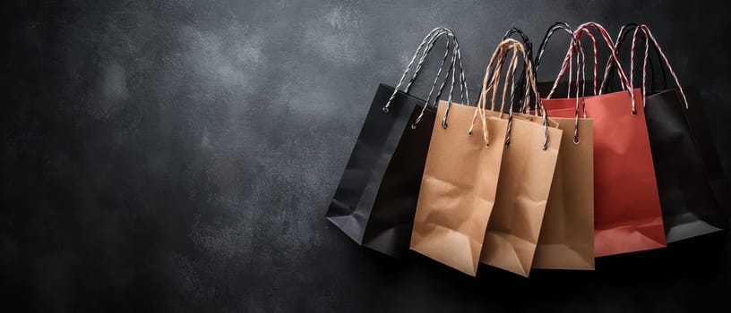 A row of colorful shopping bags against a textured dark background, perfect for retail and marketing themes with copy space.