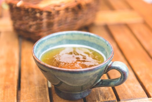 Norman apple cider in a typical ceramic cup. Shot with a selective focus