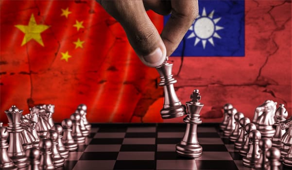 China vs Taiwan flag concept on chessboard. Political tension between China and Taiwan on pieces of chessboard