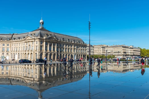 FRANCE, BORDEAUX - SEPTEMBER 20: Famous mirror fountain in front of Place de la Bourse in Bordeaux, France on September 20, 2015