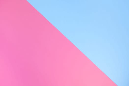 Blue and pink pastel color paper geometric flat lay background texture