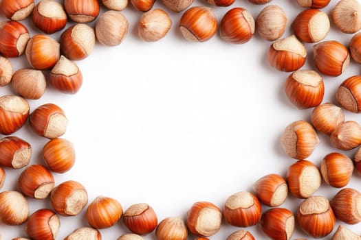 A collection of whole hazelnuts is displayed in a circular arrangement, showcasing their smooth shells and rich, brown color against a pristine white background, highlighting their natural beauty.