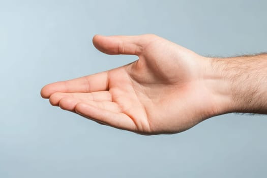 A right hand is extended in a gesture of goodwill, symbolizing agreement and collaboration. The hand appears open and inviting, suggesting a friendly interaction between individuals.