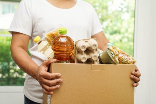 Foodstuffs in donation box for volunteer to help people.