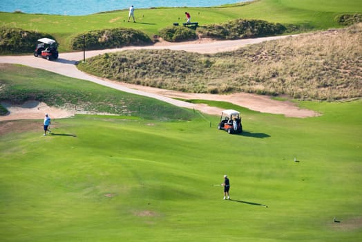 View of green golf resort field. summer vacations